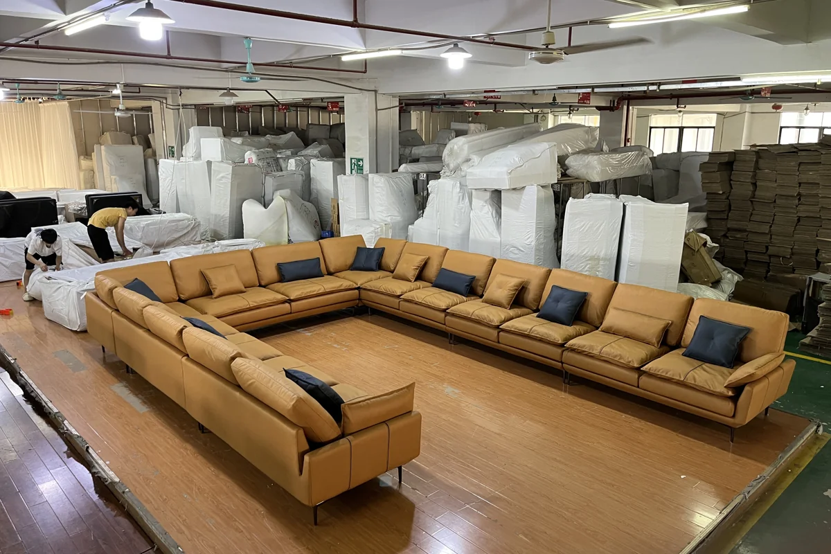 Large tan sectional sofa in a partner-factory setting