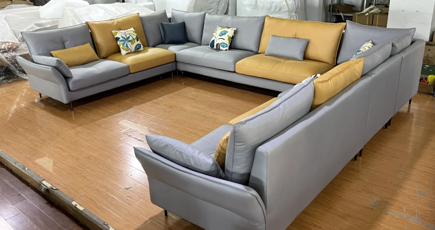 Grey and yellow upholstered sofas photographed at a partner factory